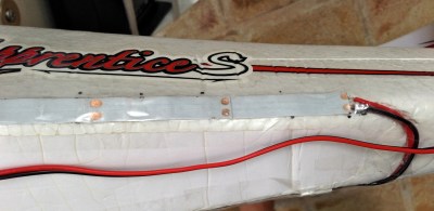 Two strips are connected by a direct solder