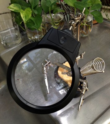 Helping hands with a magnifier