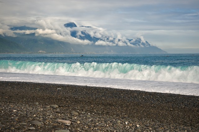 CiSingTan Bay with fixed-net fishing operations close to shore, and the Central Mountain Range in the background, in Hualien County in Taiwan