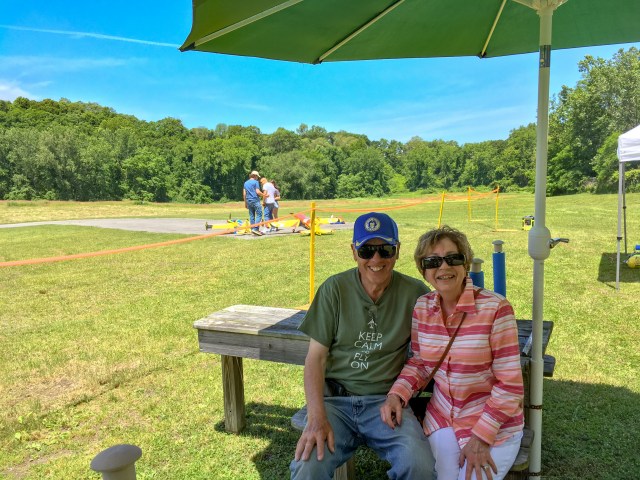 Gene and Joanna taking refuse under shade