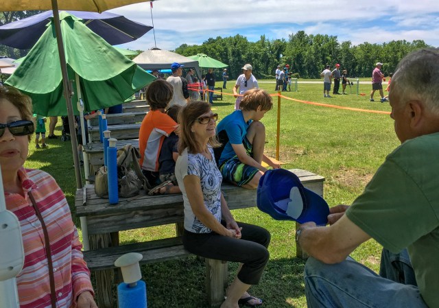 Visitors learn about the aerodrome from members