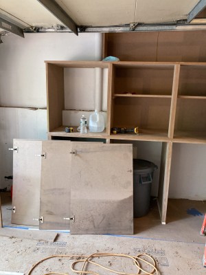 Doors for the lower cabinets housing trash cans