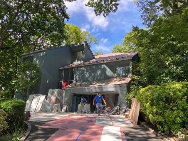 Painted doors are left to dry on tarp