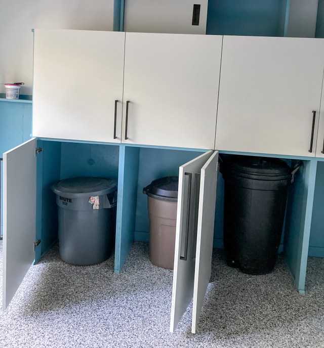 Trash cans safely hidden away behind cabinet doors
