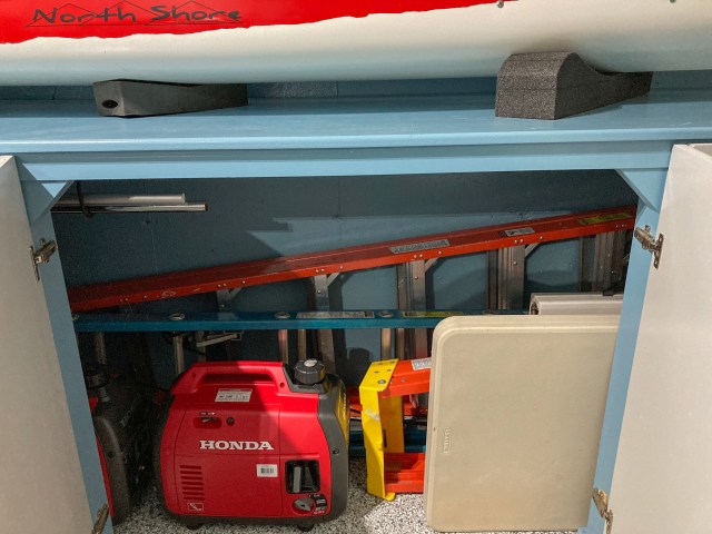 Storage space for ladders, flag pole, tree pruner, folding tables and inverters