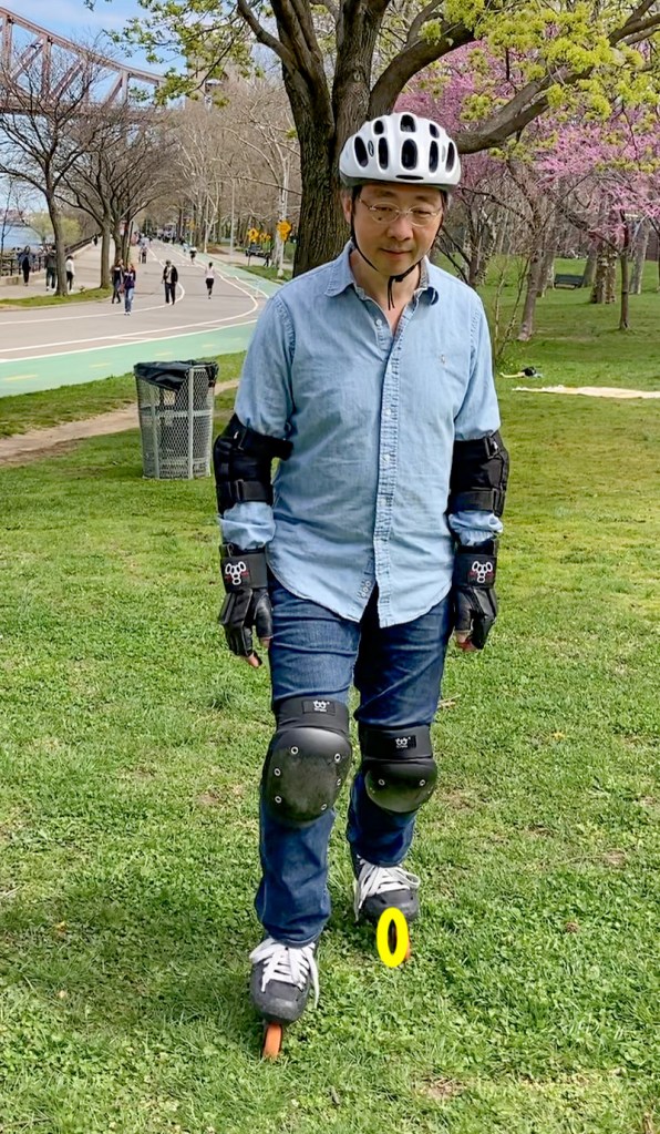 The yellow circle indicates a wheel on the left skate that seemingly shoulders the weight of my entire body, in this scissor posture.