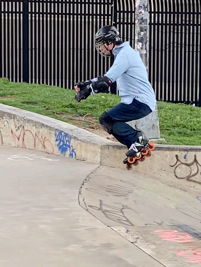 Both legs release stored energy to initiate the jump. As soon as skates lift off ground, knees bend to clear skates off obstacles during the jump.