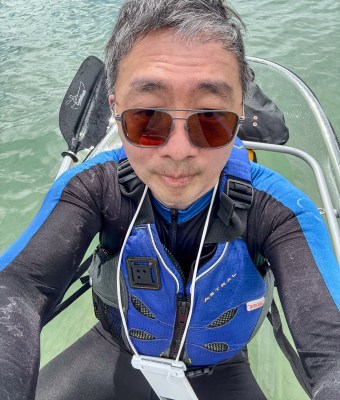 On a clear-bottom boat from Clear Kayak Adventures at Ala Moana Reef - carrying a waterproof phone bag