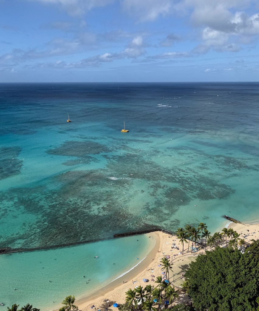 Na Hoku 3 returning to shore close to surfers at Canoes break
