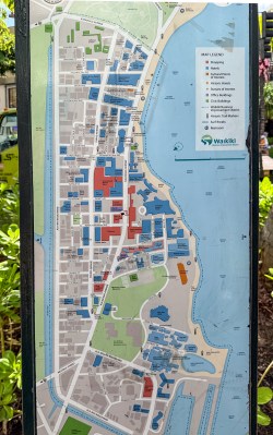 Official map of Waikiki peninsula, hotels, beaches, restrooms, and surf breaks, published by the Waikiki Business Improvement District